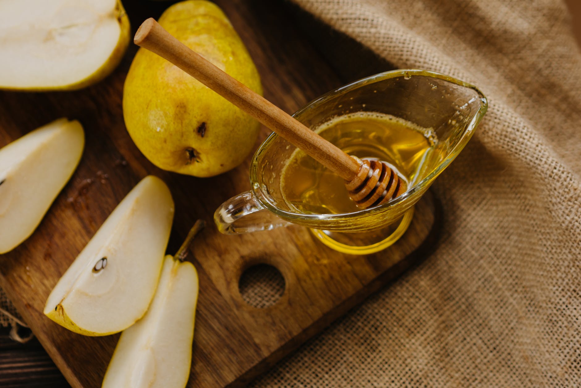 honey with pears on cutting board